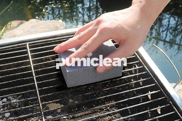 griddle cleaning block in use on commercial grill