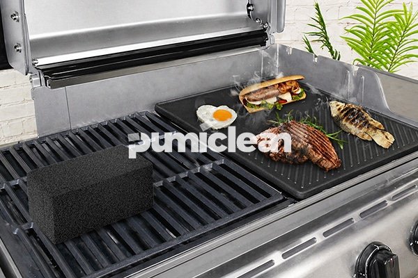 using a grill cleaning brick on commercial griddle