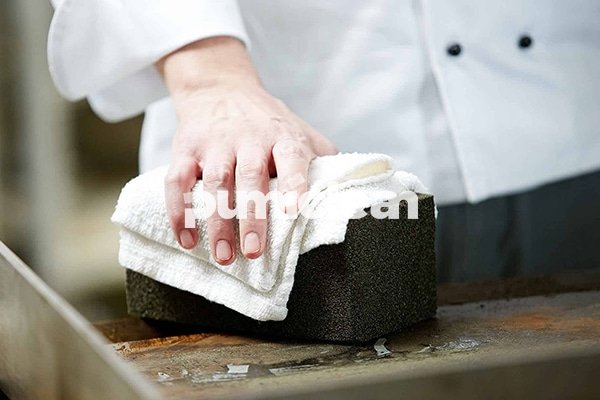 application scene: chef using brick for cleaning grill in commercial kitchen