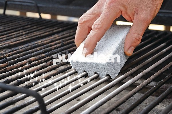 pumice stone cleaning a grill surface