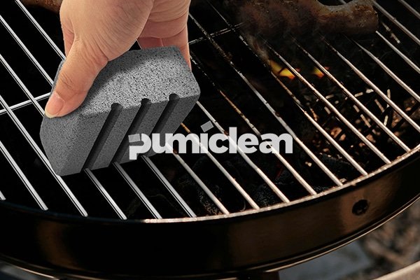 grill cleaning brick in use on a commercial griddle